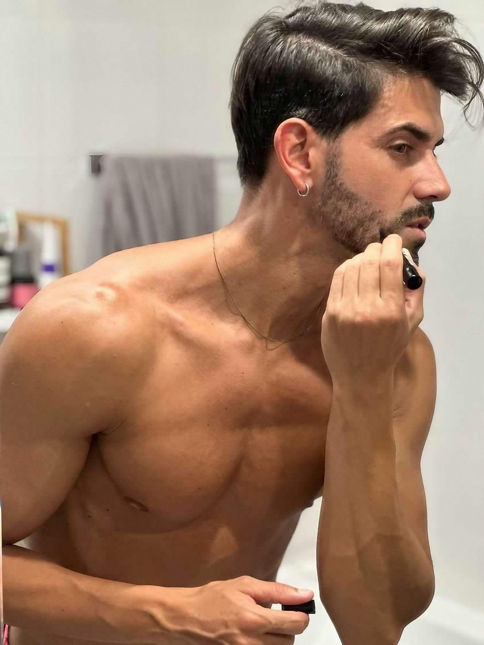 A man grooming his beard pencil and beard brushwith KingPin Beard Co. 2 IN 1: Beard Filler Pencil
